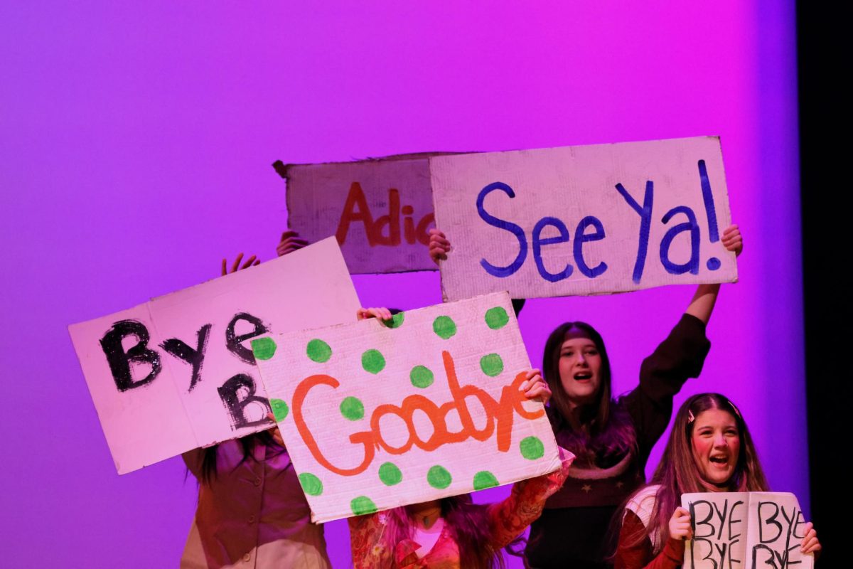 BYE-BYE. Members of the chorus sing a speller off the stage after the speller missed their word. 