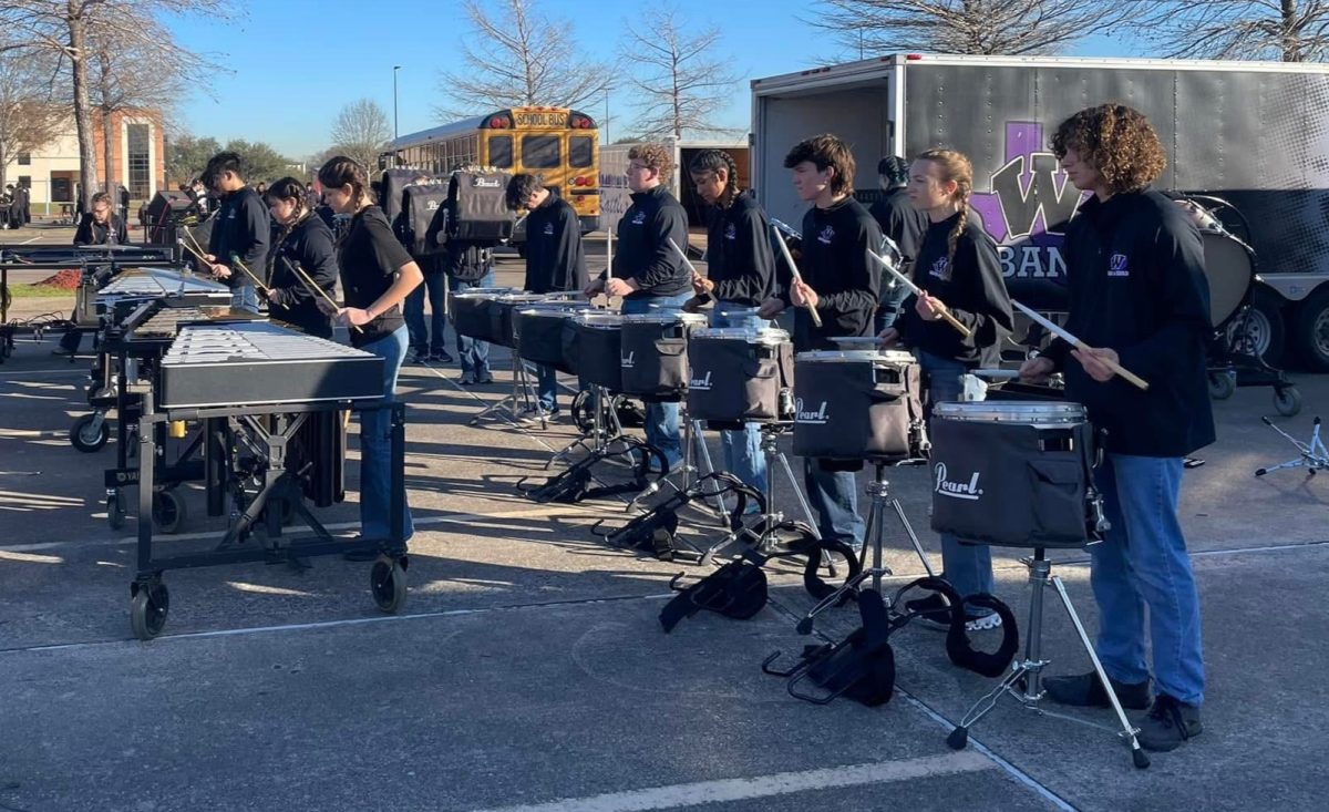 OUTSIDE WARM-UP. At the percussion competition in Pasadena, members of the band prepare for their first contest back. 