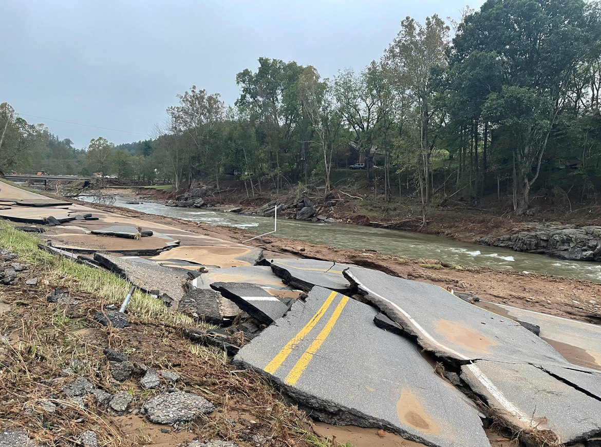 No road left to travel. Helene wipes away roads with extreme flooding till the only thing to remind that it’s a road are the yellow lines. Courtesy of Appalachian Rebuild Project