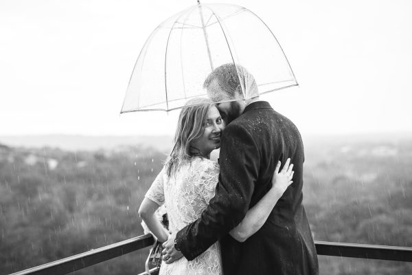 LUCKY DAY. Enjoying the good luck rain on their wedding day, English teachers DeAnna Slovak and Chris Slovak pose on the happiest day of their lives.  courtesy of DeAnna Slovak