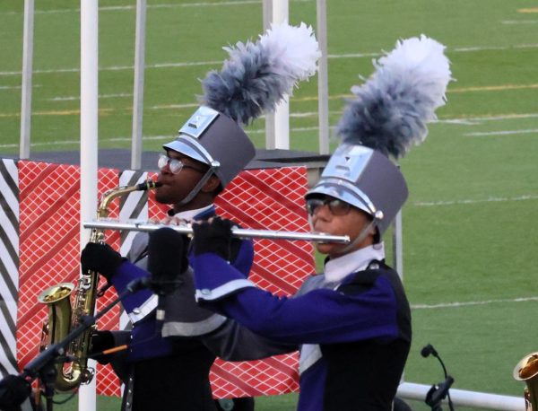 MULTITALENTED. Playing a flute during UIL Marching Contest, sophomore Drue  Walker competes with his fellow band members. Walker recently was named the top piccolo player in Texas.