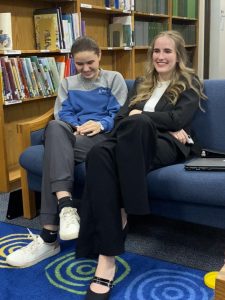 WAITING FOR THEIR TURN. At the speech competition on Wednesday, junior Zoe Mendes and senior Danica Sundquist wait for their competition time. The speech team and ready writing competed at Caney Creek on Wednesday.