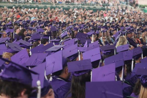 MAY 24 VIBES.  A sea of purple hats fill the Cynthia Woods Mitchell Pavilion at the 2024 graduation. This year the venue has changed for the ceremony to Johnson Coliseum at SHSU. 