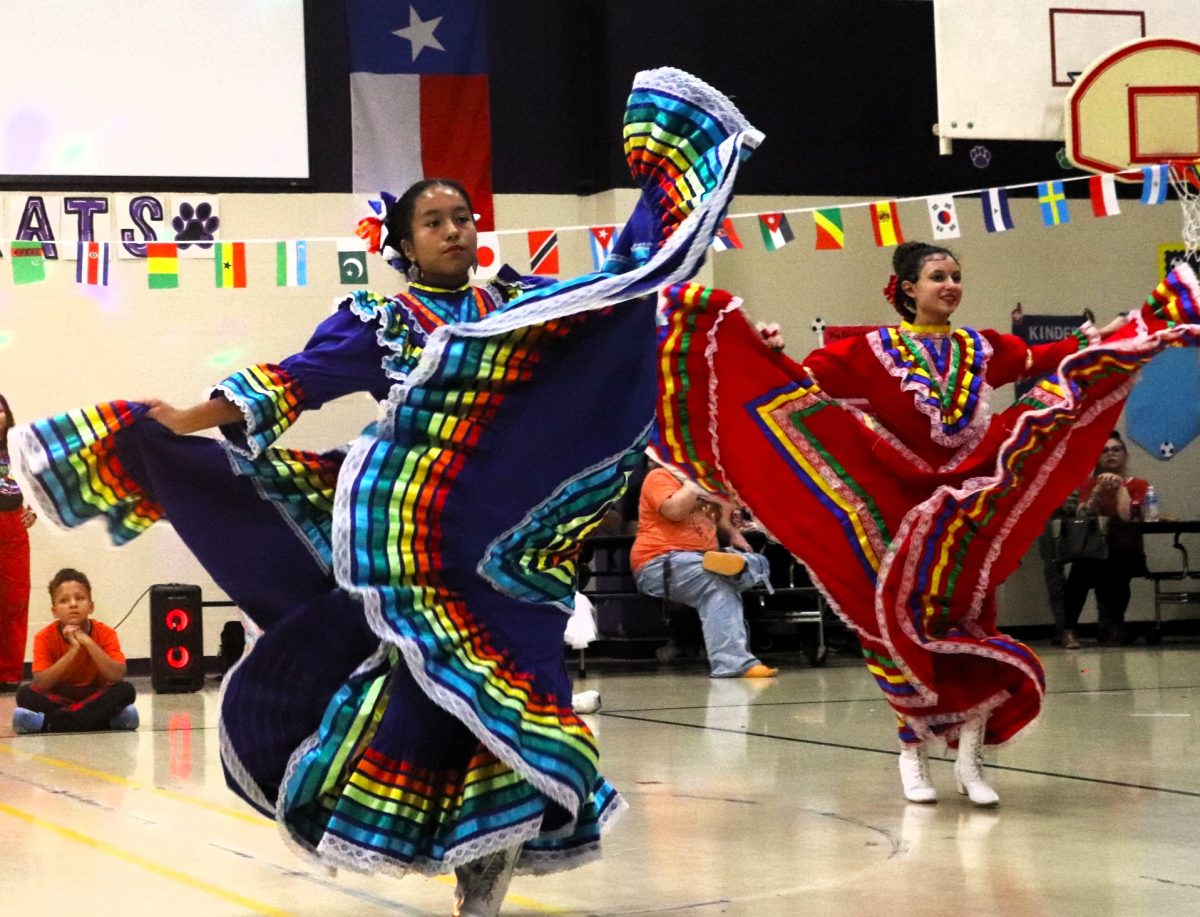  COLORFUL AND GRACEFUL. All dressed up, a group of guest dancers dance the Baile Folklorico to show off their established talents. Many hispanic dance groups made an appearance to C.C Hardy’s Fiesta Night in their traditional dresses.