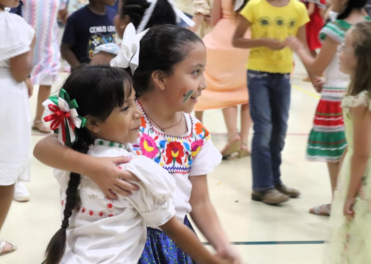 GRAB A FRIEND. The students at C.C. Hardy enjoyed cutting it up on the dance floor after a fun day of parades and games to celebrate hispanic heritage. 