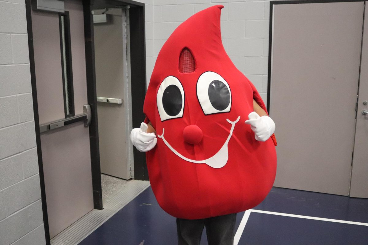 SAVE THREE LIVES. At the 2024 fall blood drive, a HOSA member dresses up to promote saving lives. 