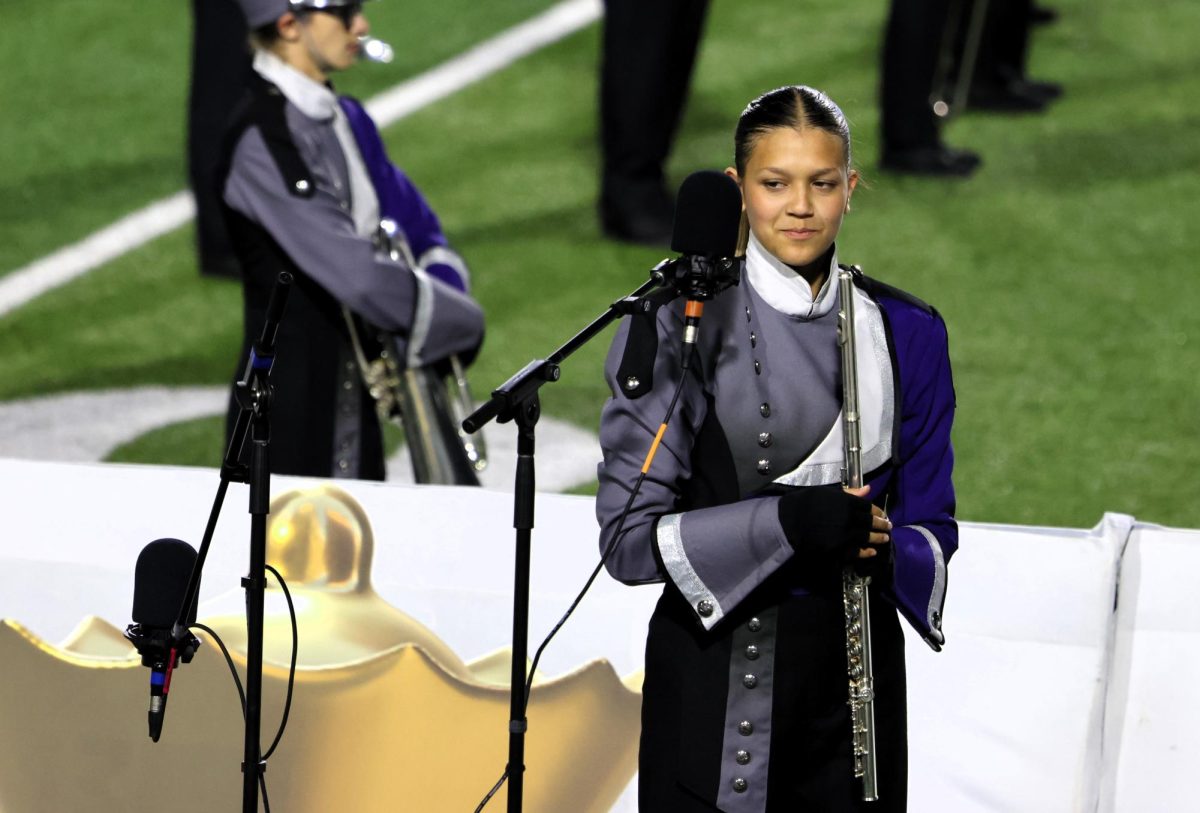 READY TO DAZZLE.  Waiting for her turn to solo, junior Alaina Fogleman joins the band at Woodforest Stadium in Conroe.  Before the contest on Tuesday the band had a stadium practice day on Saturday. 