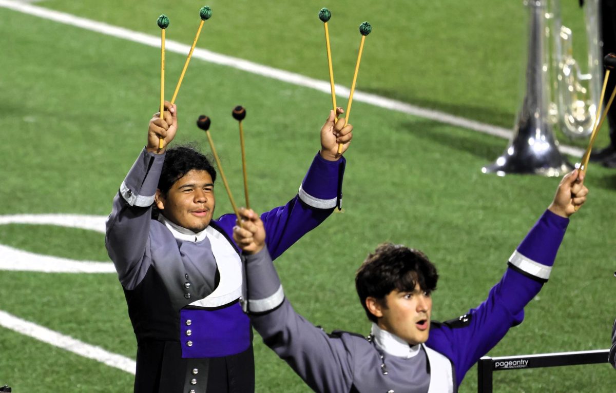 MOVING ON. With his mallets held high, senior Manuel Araiza celebrates. After their Sweepstakes honors at UIL, the group will compete on Monday for the chance to qualify for state.
