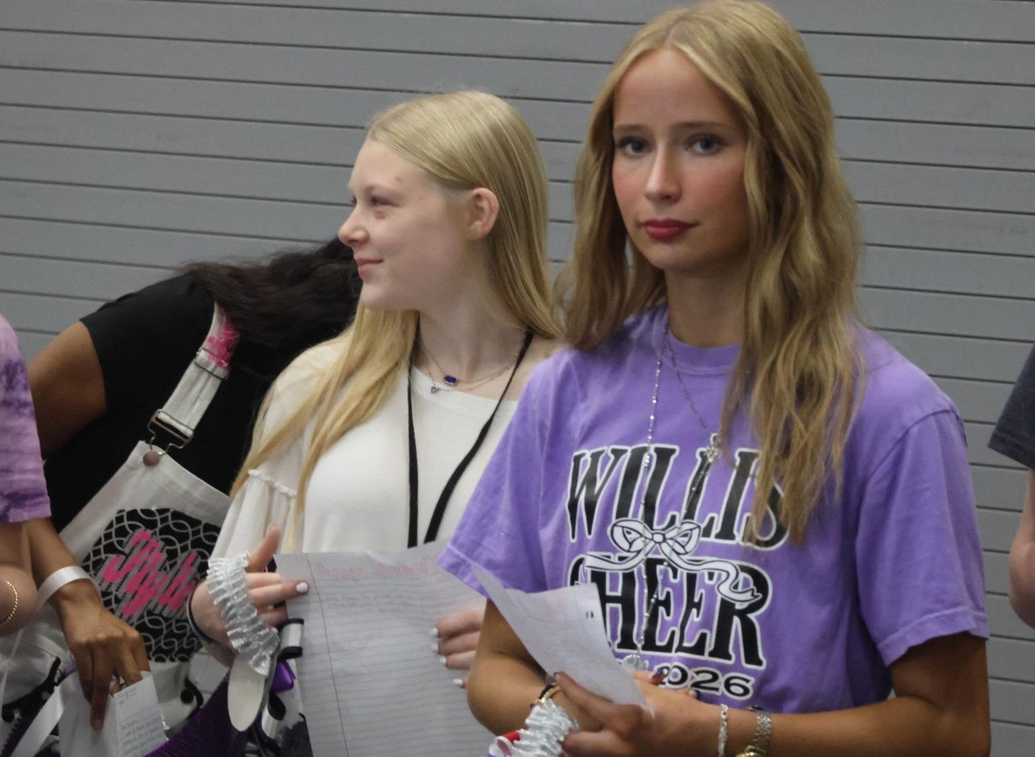 WAITING IN THE WINGS. Looking forward to their turn to present their mums, senior Jordynn Sager and junior Sabrina Nasiers and by during the first period ceremony.