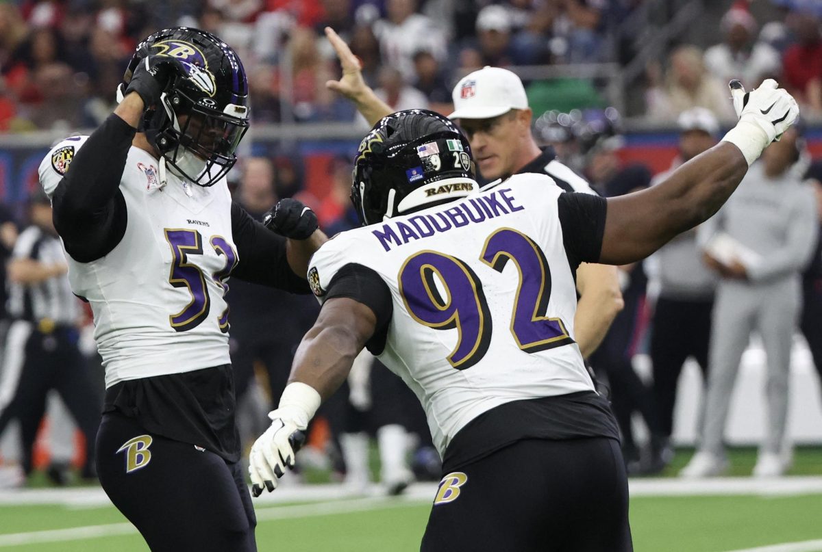 Dec 25, 2024; Houston, Texas, USA; Baltimore Ravens defensive tackle Nnamdi Madubuike (92) celebrates  linebacker Kyle Van Noy (53) sack against Houston Texans quarterback C.J. Stroud (7) (not pictured) in the first quarter at NRG Stadium. Mandatory Credit: Thomas Shea-Imagn Images