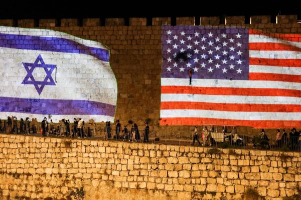 United States and Israel flags are projected on the walls of the Old city of Jerusalem in celebration after Israel and Hamas agreed to the first phase of U.S. President Donald Trump's plan to end the war in Gaza, October 9, 2025. REUTERS/Sinan Abu Mayzer