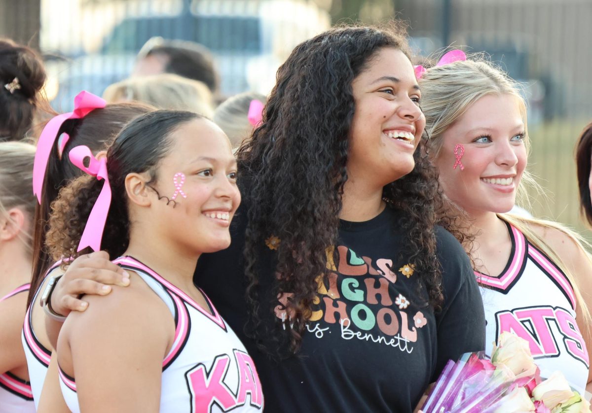 FAVORITE TEACHER. Seniors Desaray Wilkinson and Maddie Mar Bratoon walk with their choice for favorite teacher, English teacher Chelsie Bennett. 