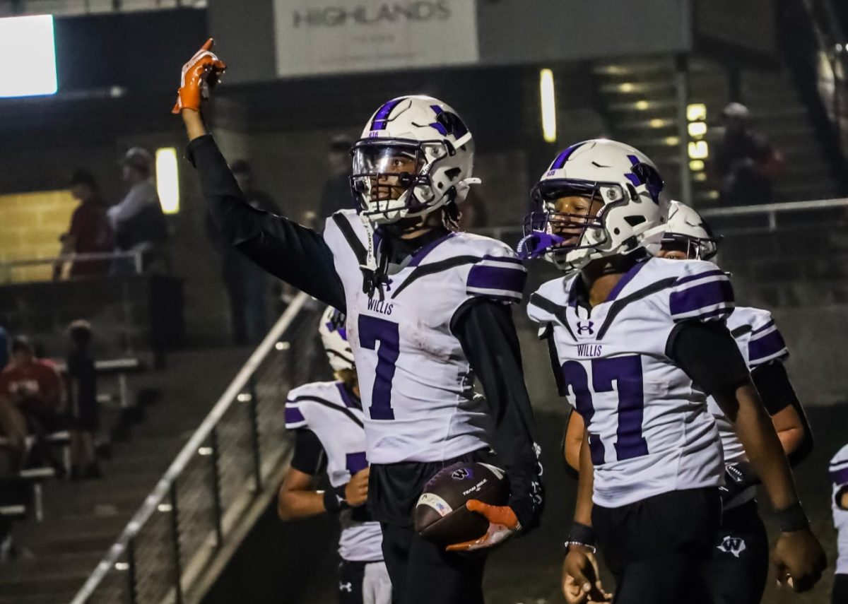 GET LOUD. After a touchdown celebration senior Jermaine Bishop and sophomore Jayden Lane works to get the crowd hyped.