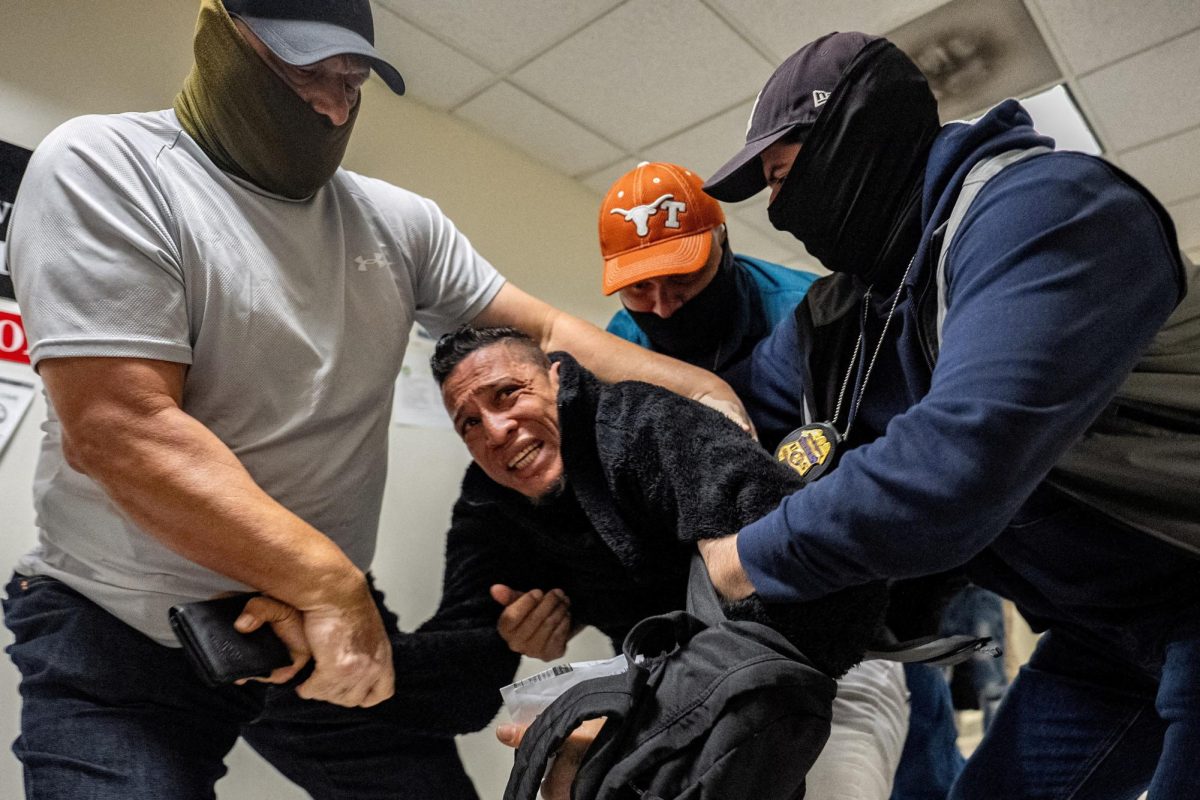 U.S. Immigration and Customs Enforcement (ICE) agents and federal officers detain a migrant as he walks out from a hearing during targeted detainment at a U.S. immigration court in Manhattan, in New York City, U.S., October 27, 2025. REUTERS/David 'Dee' Delgado