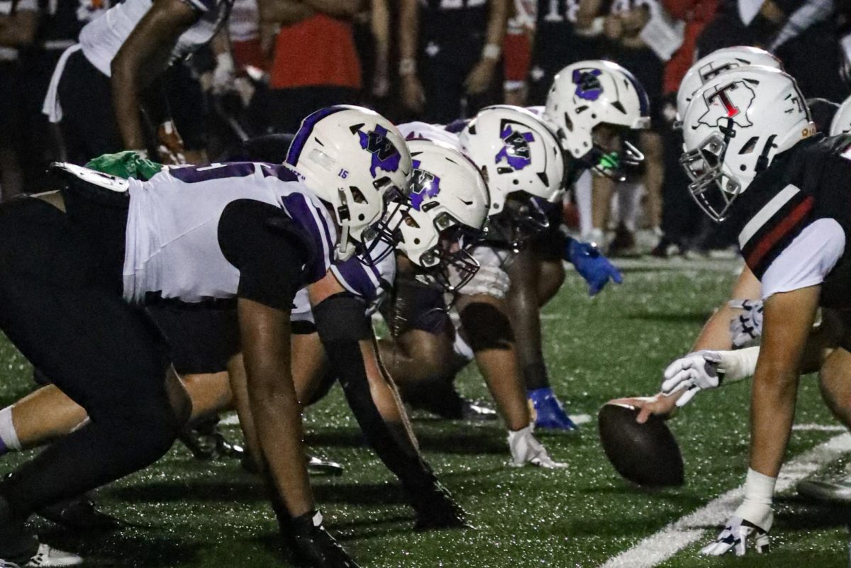 DEFENSE. At the line of scrimmage, the defensive line prepares to stop the Tomball offense. 