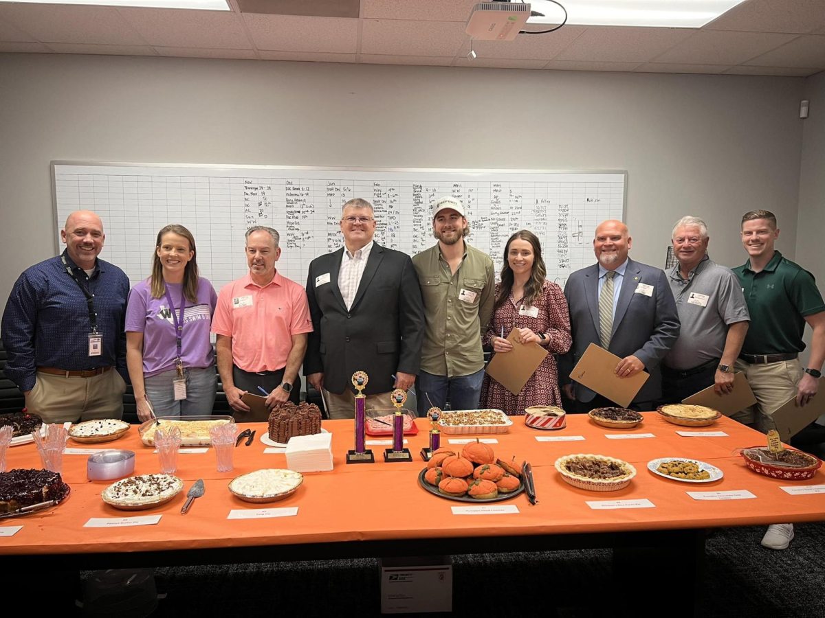 THE JUDGES TABLE. Members of the community came to judge the first annual faculty dessert contest.  