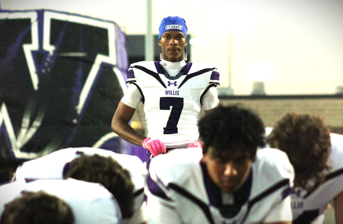 GAMETIME. In a regular season game against Cleveland, senior Jermaine Bishop joins his team for a prayer at the beginning of the match up.  Tonight Bishop and the Widlkats face the Spring Westfield Mustangs in round one of the playoffs.
