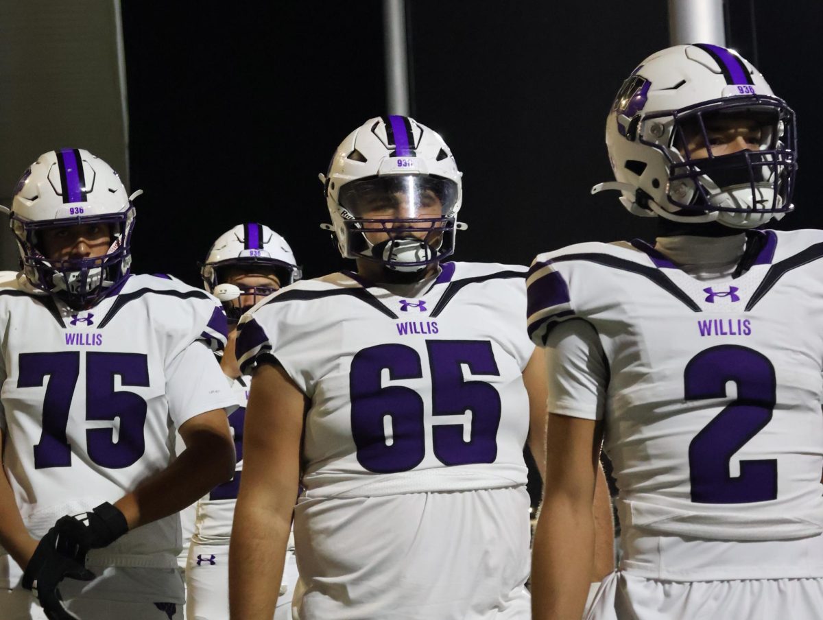 THE WALKOUT. Wildkat players Jalen Keilo and Bryce Walton walk onto the field to take on their opponents and conquer the bi-district championship trophy. Willis is in the first round of playoffs yet again, and ready to do everything it takes to succeed. 