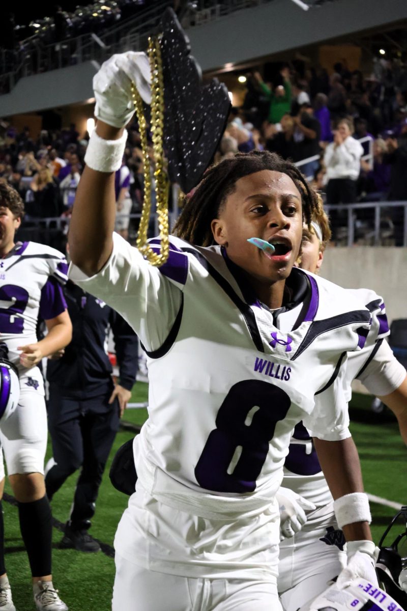 CHAIN HIM. Following a huge play, sophomore Jamal Lagway runs down the sideline with the celebratory touchdown chain. The chain is placed onto a player after they reach the endzone. 