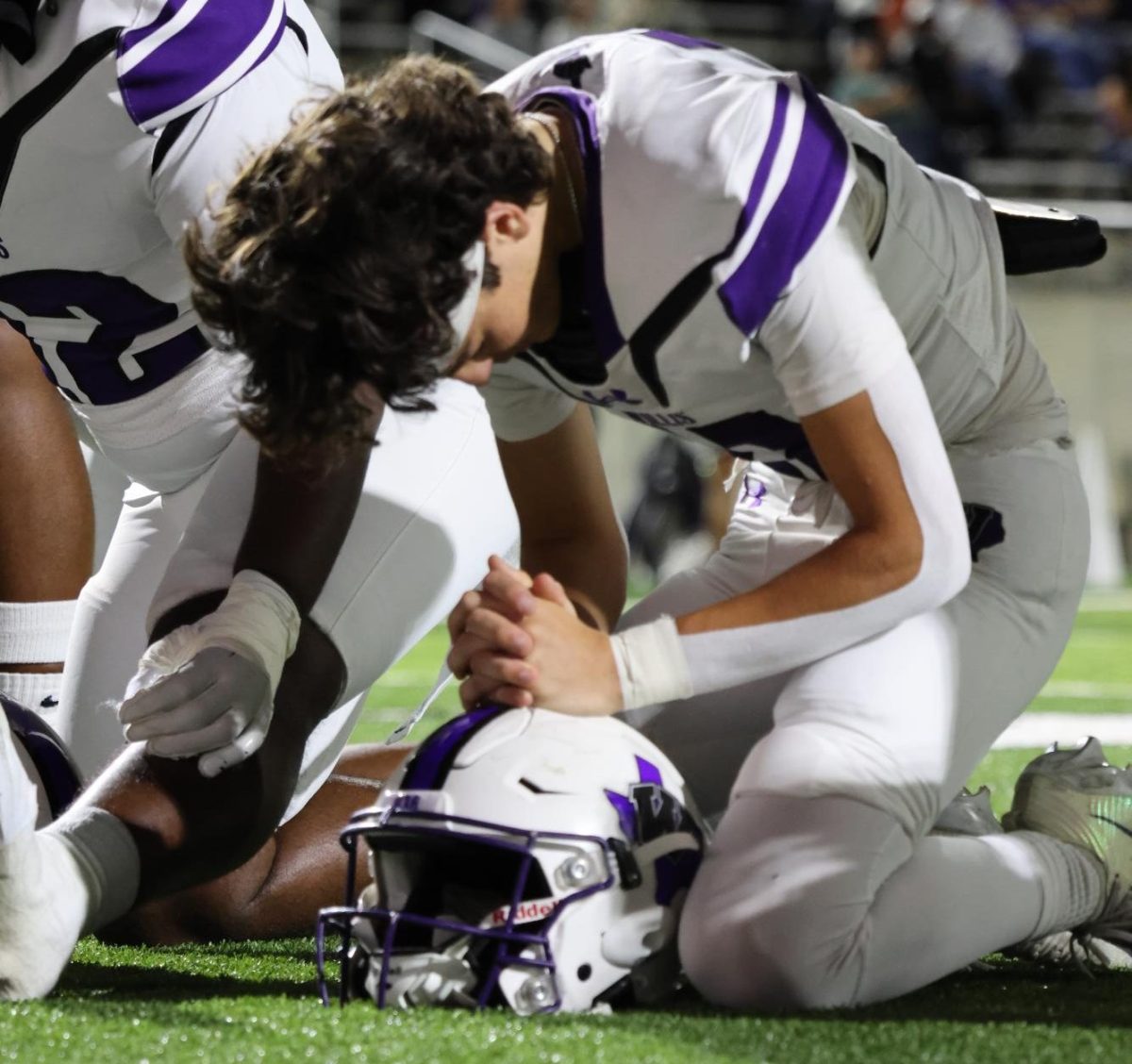 GOD FIRST. Before the game begins, senior River Shaunfield and the Wildkats take a knee in the endzone after running out to make their prayers and talk to the man above. This is a true tradition the Wildkats have done for years to recognize the opportunity they have to play such a beautiful game and thank the reason they get to play.
