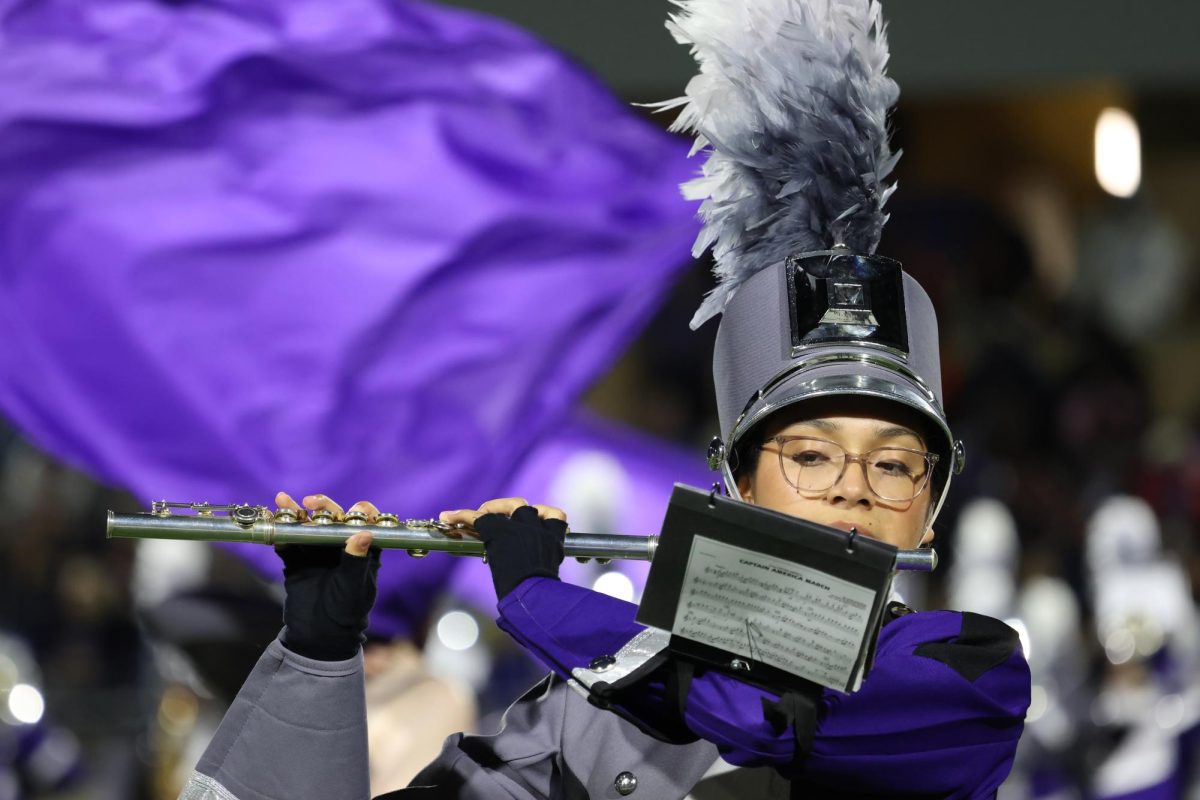 FLUTING FOR FIRST DOWN. Performing during halftime, senior Adriana Frias plays her beautiful tunes on her flute. Frias has been in the Wildkat band program for four years. 
