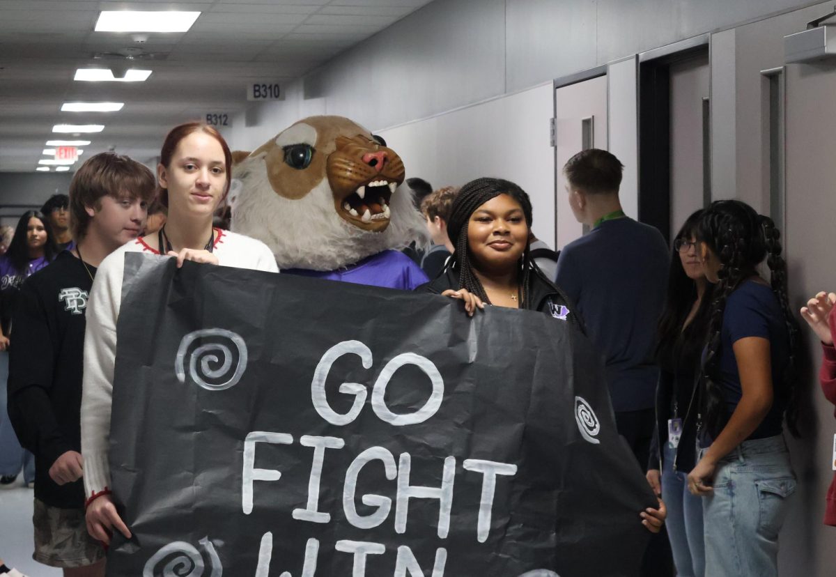 WALK OF CHAMPIONS. Celebrating the groups and teams who have achieved great things this semester, the Walk of Champions included members of the Wildkat Band, student council, varsity football, Wildkat Choir, the PitKats, FFA, Sweethearts, AFJROTC and cheer. 