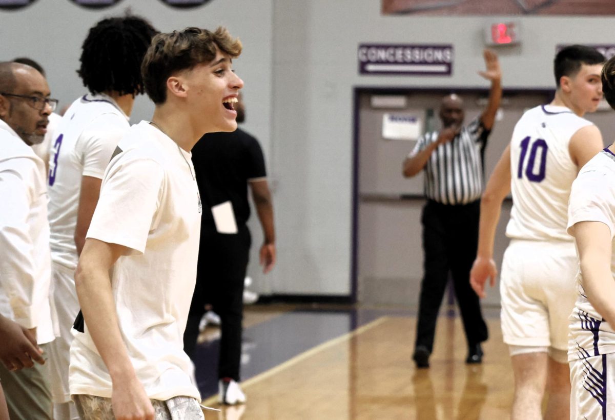 ALL SMILES. At the game against Conroe during his senior year, Irvin Cortes cheers on the team in their win over the Tigers.