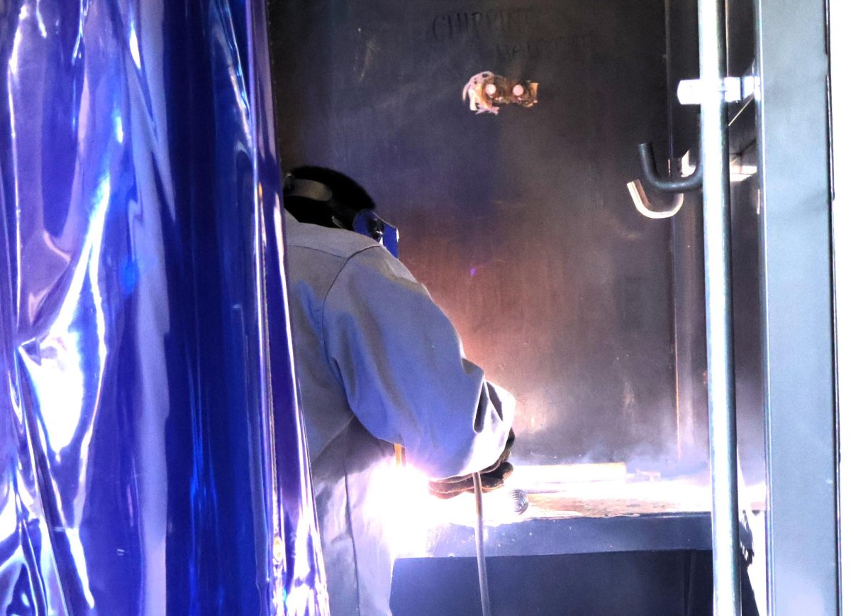 FUTURE PLANS. During Welding 2 class, a student practices laying a bead in a welding booth. Trades like welding, construction and plumbing provides a good career without a four-year degree. 