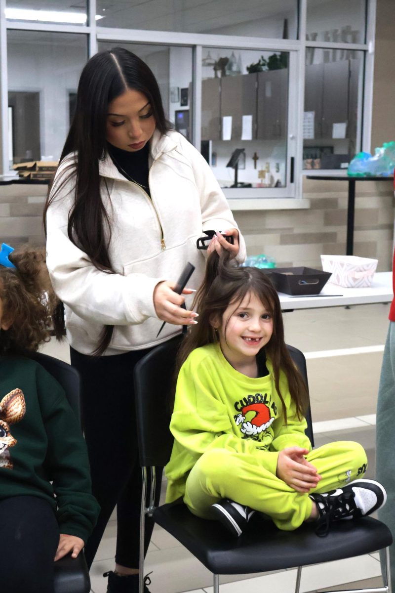 CHRISTMAS IS HERE. Campus organizations welcomed elementary students and their families for the annual Christmas in the Barn on Dec. 5. The vent was full of fun, games, cocoa and Santa Claus. 