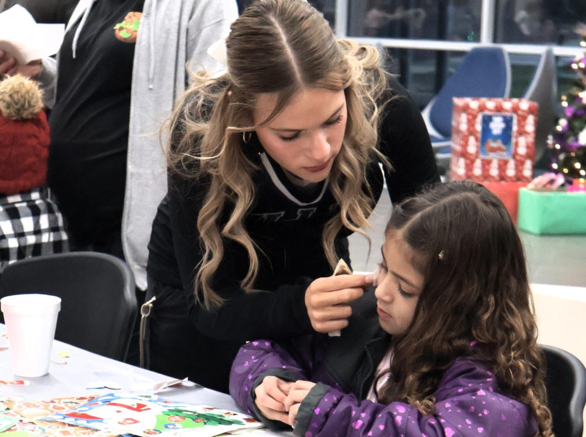 CHRISTMAS IS HERE. Campus organizations welcomed elementary students and their families for the annual Christmas in the Barn on Dec. 5. The vent was full of fun, games, cocoa and Santa Claus. 