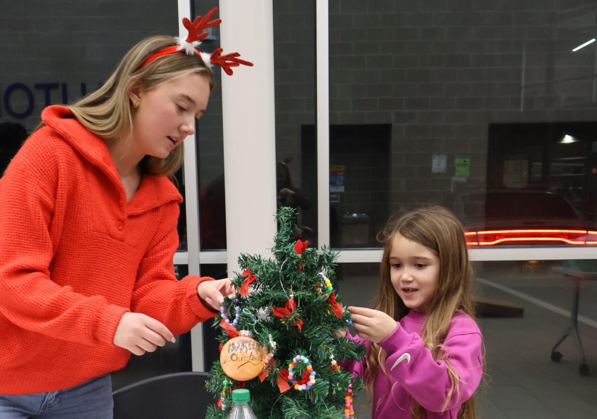 CHRISTMAS IS HERE. Campus organizations welcomed elementary students and their families for the annual Christmas in the Barn on Dec. 5. The vent was full of fun, games, cocoa and Santa Claus. 