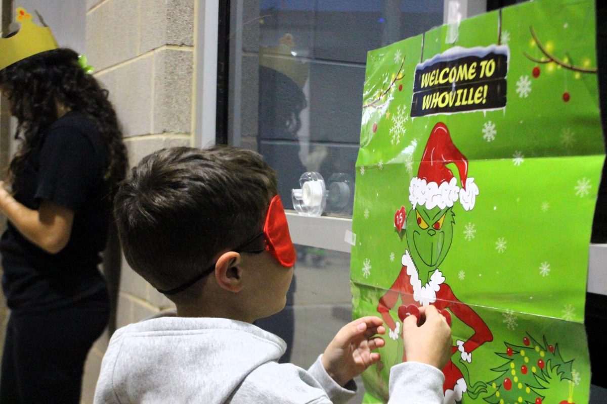 CHRISTMAS IS HERE. Campus organizations welcomed elementary students and their families for the annual Christmas in the Barn on Dec. 5. The vent was full of fun, games, cocoa and Santa Claus. 