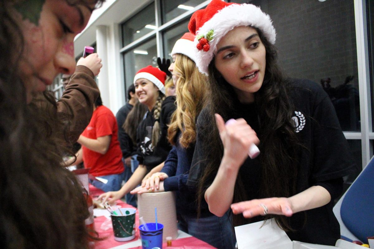 CHRISTMAS IS HERE. Campus organizations welcomed elementary students and their families for the annual Christmas in the Barn on Dec. 5. The vent was full of fun, games, cocoa and Santa Claus. 