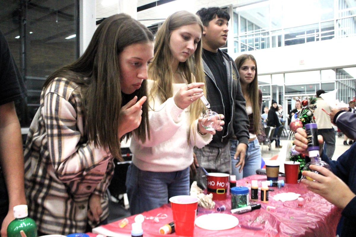 CHRISTMAS IS HERE. Campus organizations welcomed elementary students and their families for the annual Christmas in the Barn on Dec. 5. The vent was full of fun, games, cocoa and Santa Claus. 