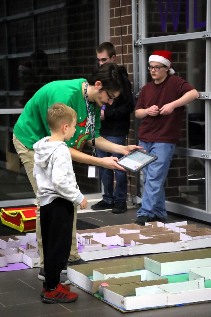 CHRISTMAS IS HERE. Campus organizations welcomed elementary students and their families for the annual Christmas in the Barn on Dec. 5. The vent was full of fun, games, cocoa and Santa Claus. 