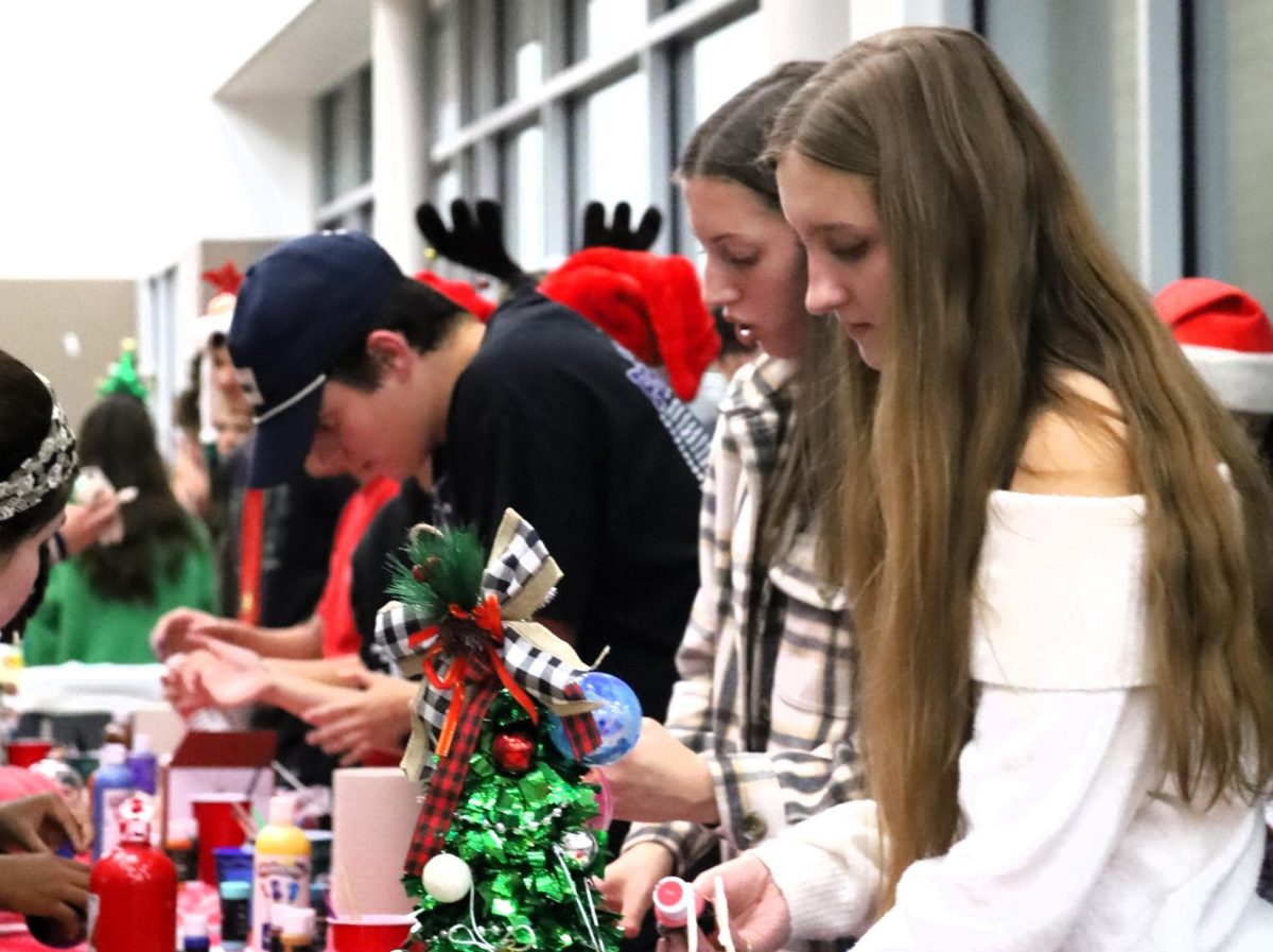 CHRISTMAS IS HERE. Campus organizations welcomed elementary students and their families for the annual Christmas in the Barn on Dec. 5. The vent was full of fun, games, cocoa and Santa Claus. 