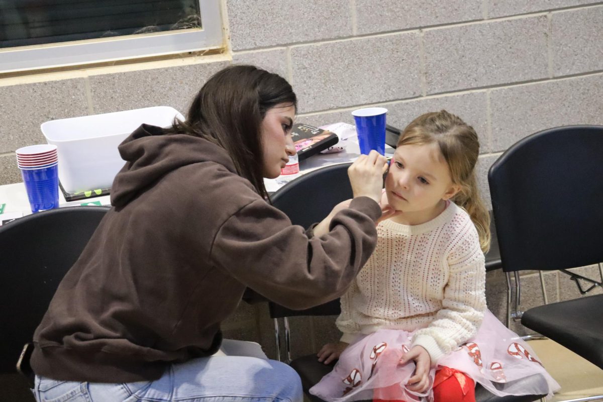 CHRISTMAS IS HERE. Campus organizations welcomed elementary students and their families for the annual Christmas in the Barn on Dec. 5. The vent was full of fun, games, cocoa and Santa Claus. 