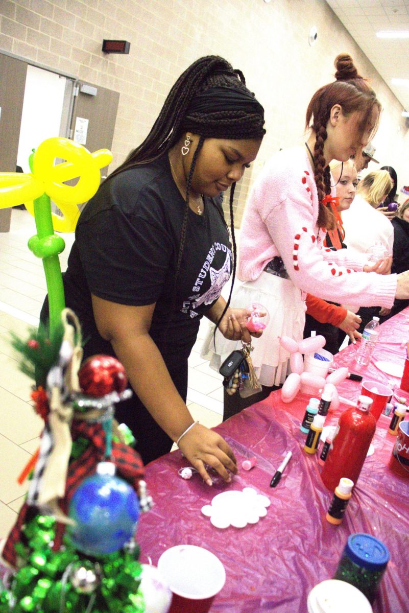 CHRISTMAS IS HERE. Campus organizations welcomed elementary students and their families for the annual Christmas in the Barn on Dec. 5. The vent was full of fun, games, cocoa and Santa Claus. 
