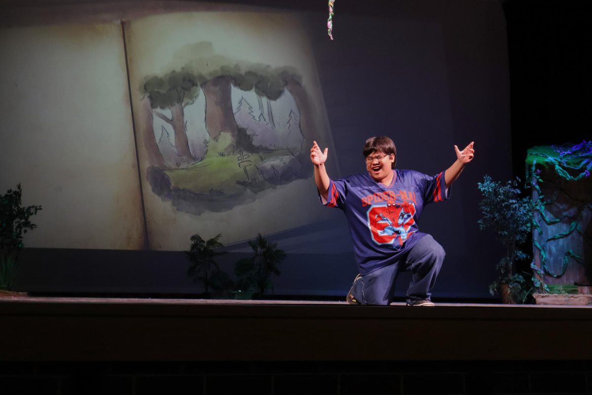 SWAMP SONGS. As the lead Shrek, senior Jhun Abarquez sings during a rehearsal for the musical. 