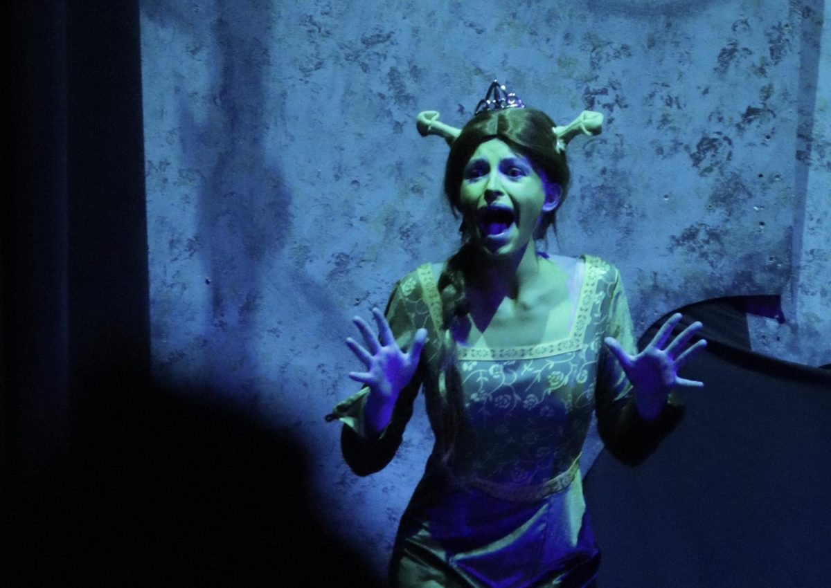 JUMP SCARE. Hiding her secret Teen Fiona (sophomore Ella Kouba), screams when Donkey discovers her appearance after dark. 