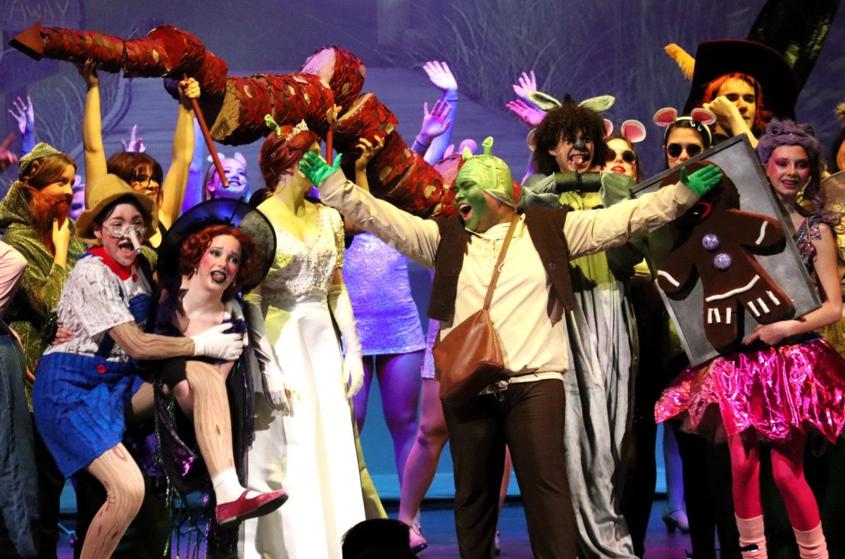 BIG, BRIGHT BEAUTIFUL WORLD. Shrek (senior Jhun Abarquez) sings with the fairy tale creatures as they celebrate his love with Fiona. 