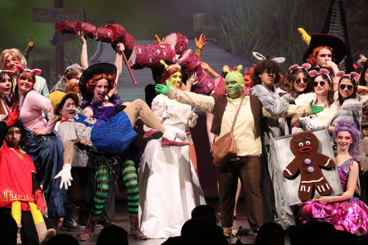 LET YOUR FREAK FLAG FLY. Shrek (senior Juhn Abarquez) and Fiona (Sophia Von Kuschembahr) joins all the fairy tale creatures at the end of the musical.