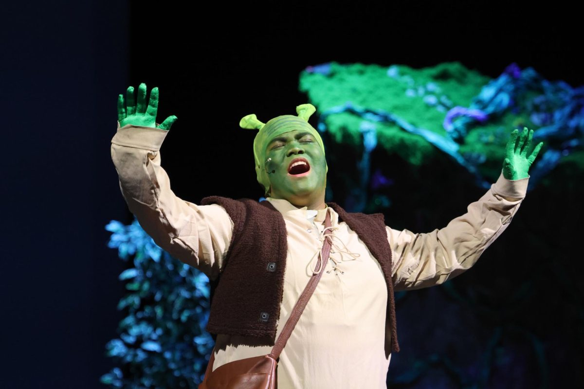 GET OUT OF MY SWAMP. Shrek (senior Jhun Abarquez) sings during the Friday night performance of the musical.