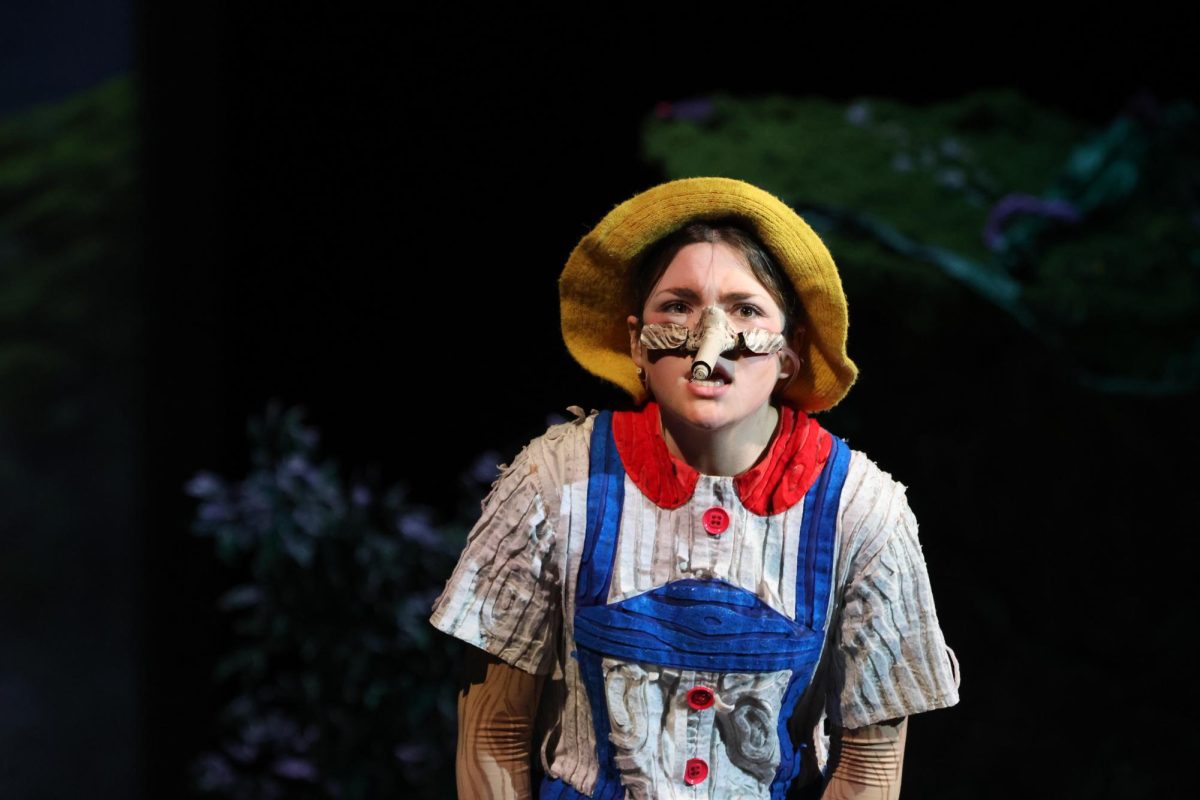 I'M A REAL BOY, HONEST. Pinocchio (junior Emma Johnston) tries to convince the other fairy tale creatures she is not lying.
