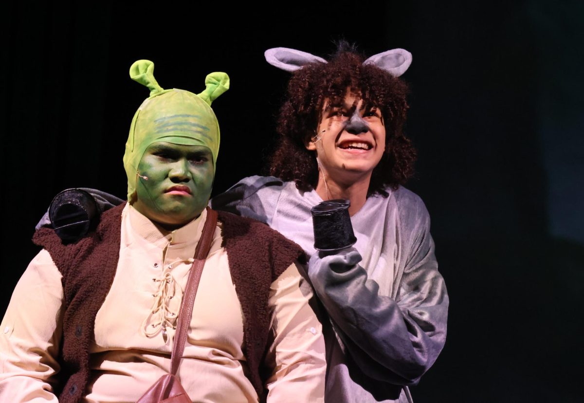 BEST FRIENDS. Donkey (sophomore Chege Wechege) tries to convince Shrek (senior Jhun Abarquez) that they are the best of friends. 