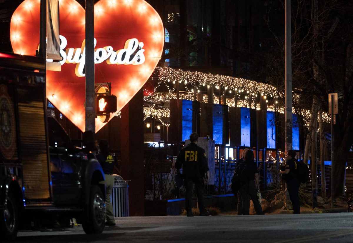 Law enforcement officers work at the scene after a deadly mass shooting outside Buford's, a popular roadhouse-style bar in Austin, Texas, U.S. March 1, 2026.  REUTERS/Nuri Vallbona
