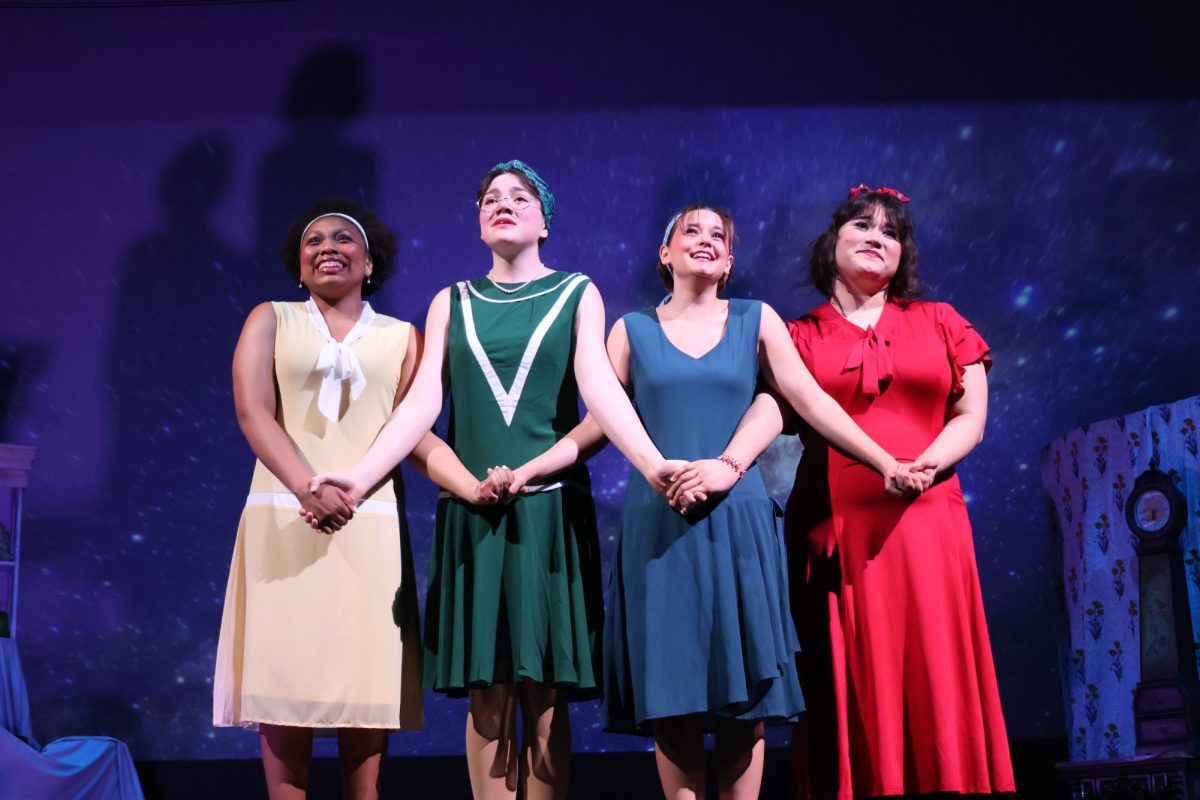 UNITED. At the close of the play, sophomore NaLani Washington, junior Emma Johnston, junior Olivia Calvello and senior Avalon Barretto stand together after telling their story. The play advanced from zone to district competition. 