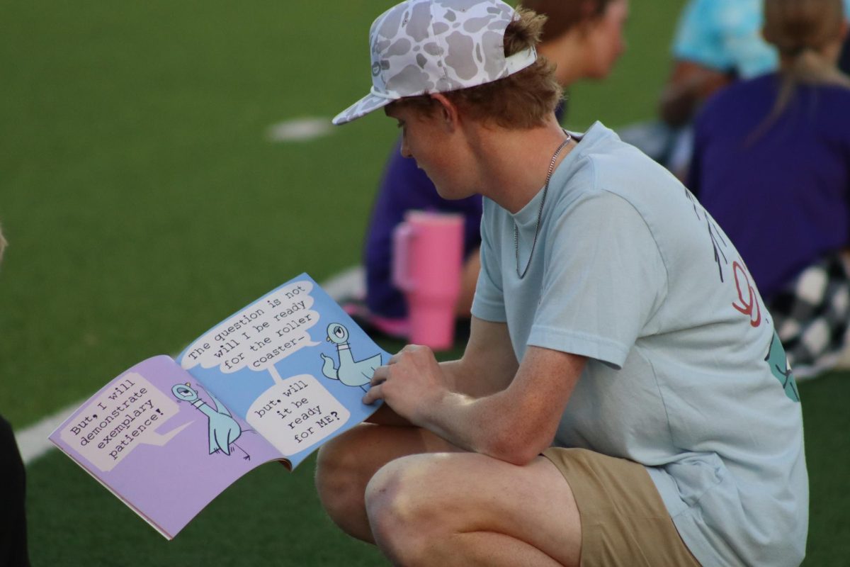 BACK TO THE BOOKS.  Junior Cayden Britton reads during Reading Under the Lights at Berton A. Yates on March 2. 