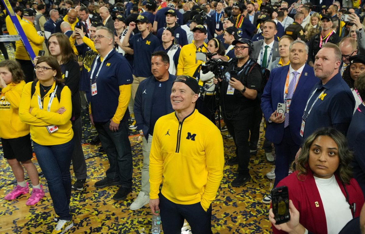 Apr 6, 2026; Indianapolis, IN, USA; Michigan Wolverines head coach Dusty May watches One Shining Moment after defeating the Connecticut Huskies in the national championship of the Final Four of the men's 2026 NCAA Tournament at Lucas Oil Stadium. Mandatory Credit: Robert Deutsch-Imagn Images
