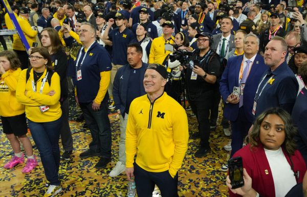Apr 6, 2026; Indianapolis, IN, USA; Michigan Wolverines head coach Dusty May watches One Shining Moment after defeating the Connecticut Huskies in the national championship of the Final Four of the men's 2026 NCAA Tournament at Lucas Oil Stadium. Mandatory Credit: Robert Deutsch-Imagn Images